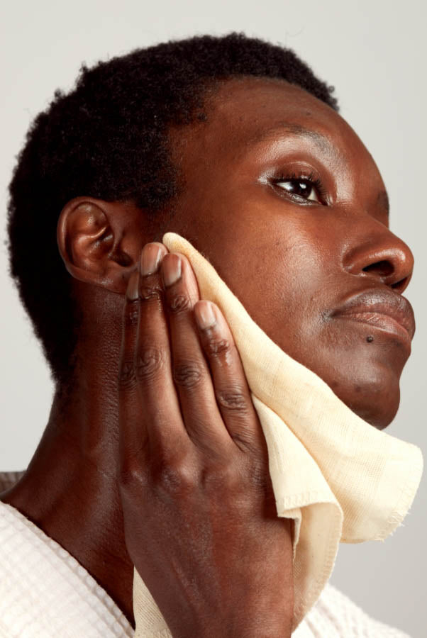 woman using muslin face cloth