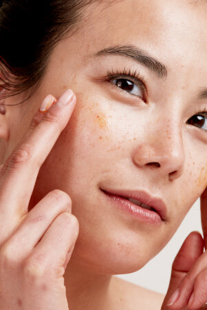 Rosehip Bioregenerate Oil being applied to face