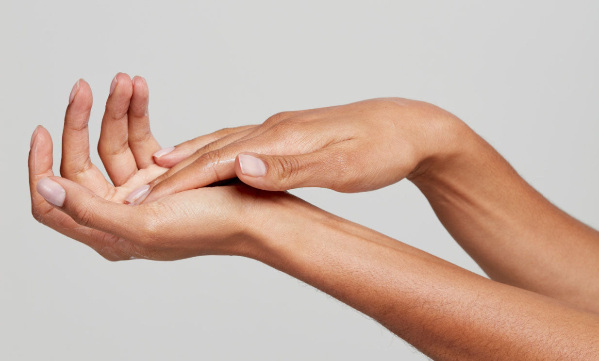 Woman using hand cream