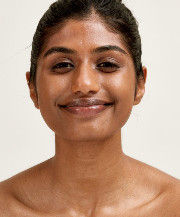 Smiling woman with glowy skin