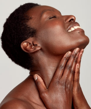 woman touching her neck