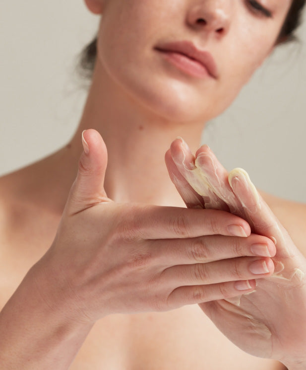 woman using hand cream