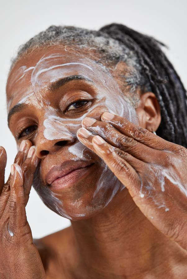 Woman using face mask