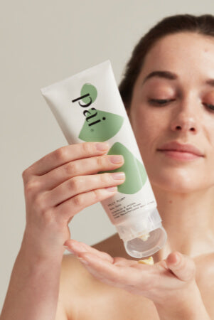 woman using Pai body cream